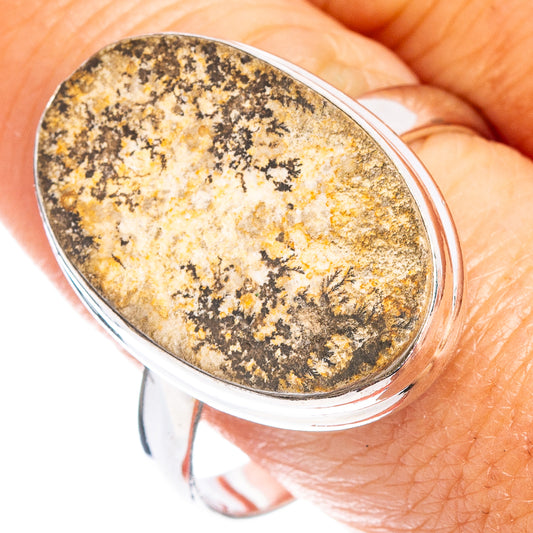 Polished sterling silver oval ring with dark speckled psilomelane stone face