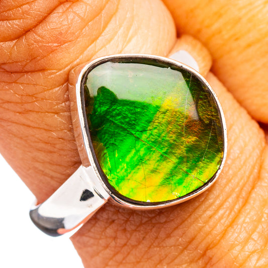 Size 9 sterling silver ring with oval green-yellow iridescent ammolite bezel