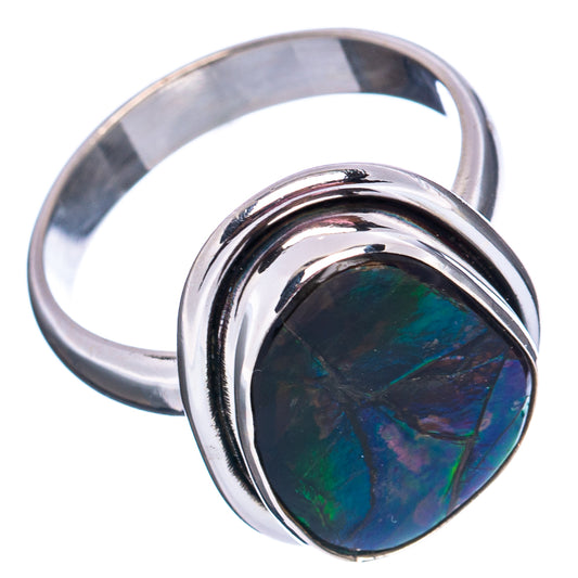 Sterling silver ammolite teardrop ring showing dark blue-green shimmer