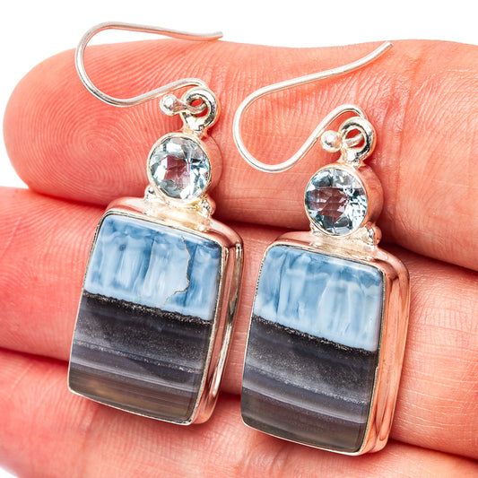 Sterling silver blue topaz and blue opal square-drop earrings on finger