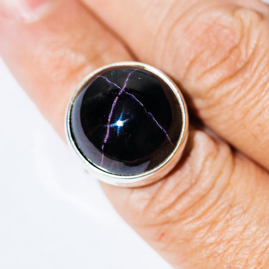 .925 sterling silver star garnet ring with round bezel-set cabochon gemstone