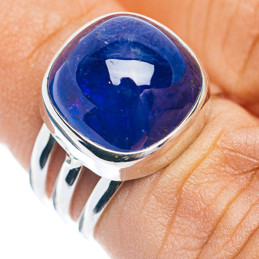 Sterling silver ring with large oval blue gemstone cabochon, polished setting