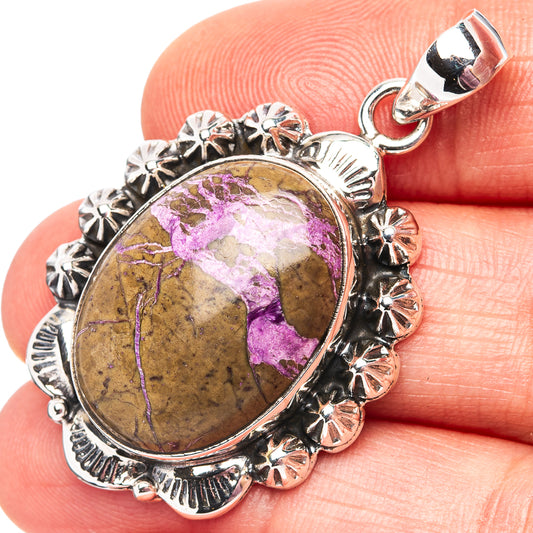 Oval purpurite pendant in sterling silver with ornate petal bezel and purple cabochon