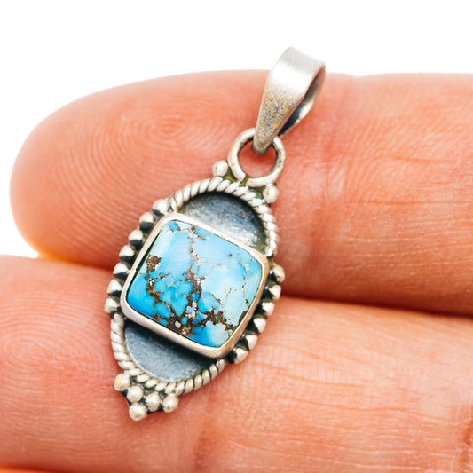 Turquoise cabochon silver pendant with rope border and small bead accents