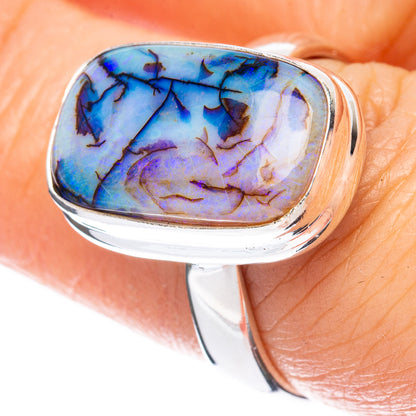 Sterling silver opal ring with oval blue-purple stone, polished bezel