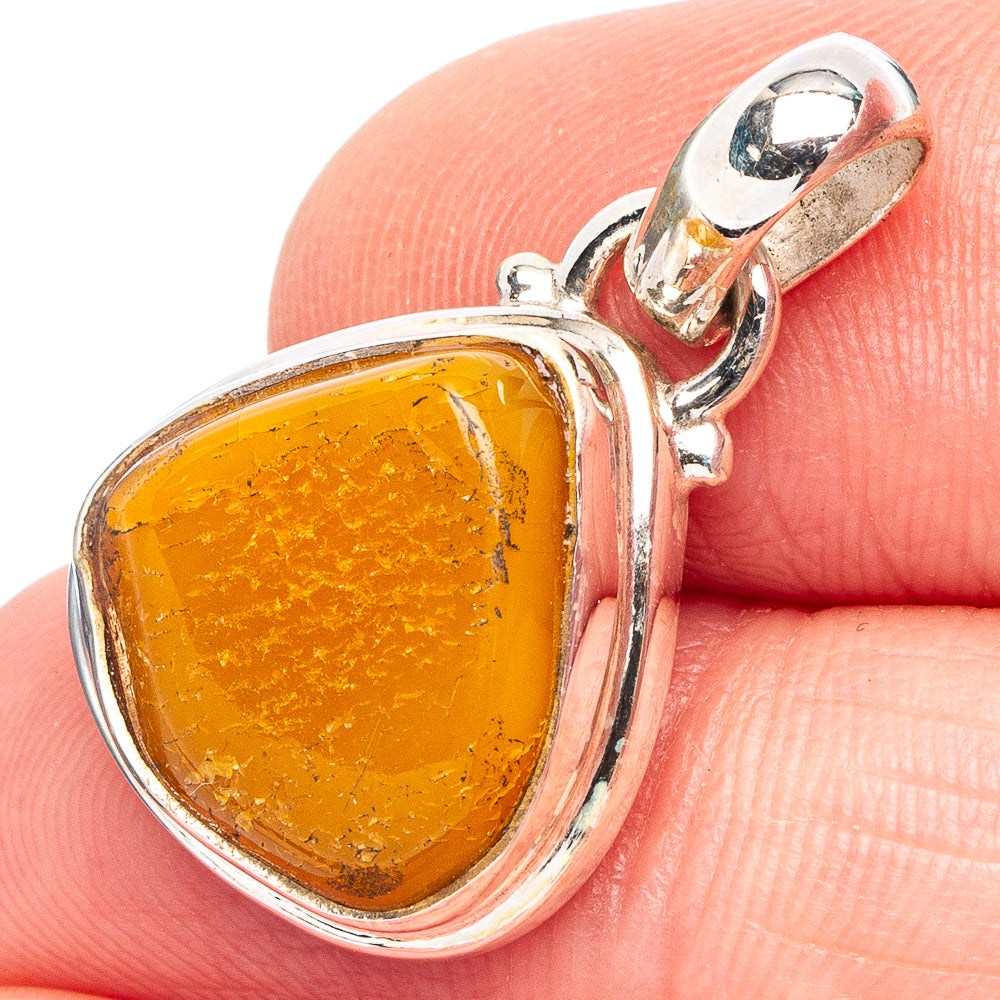 Teardrop amber pendant with .925 sterling silver bezel and top loop