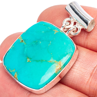 Turquoise oval pendant in 925 sterling silver with polished bezel and bail