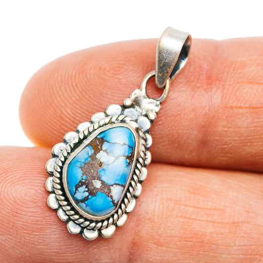 Turquoise cabochon pendant in .925 sterling silver with ornate border