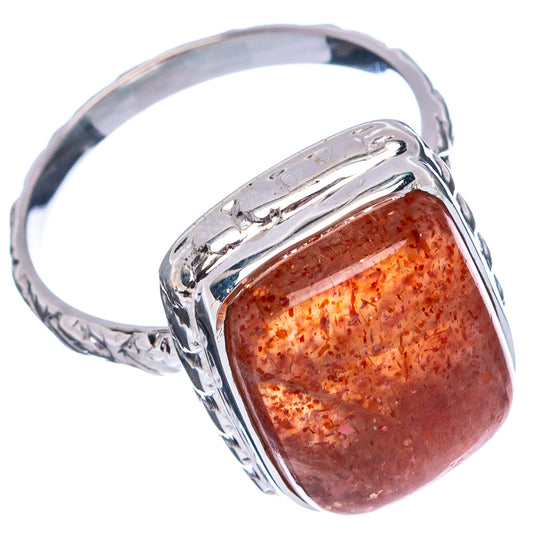 Sterling silver sunstone ring with marbled red/orange cabochon, rounded bezel