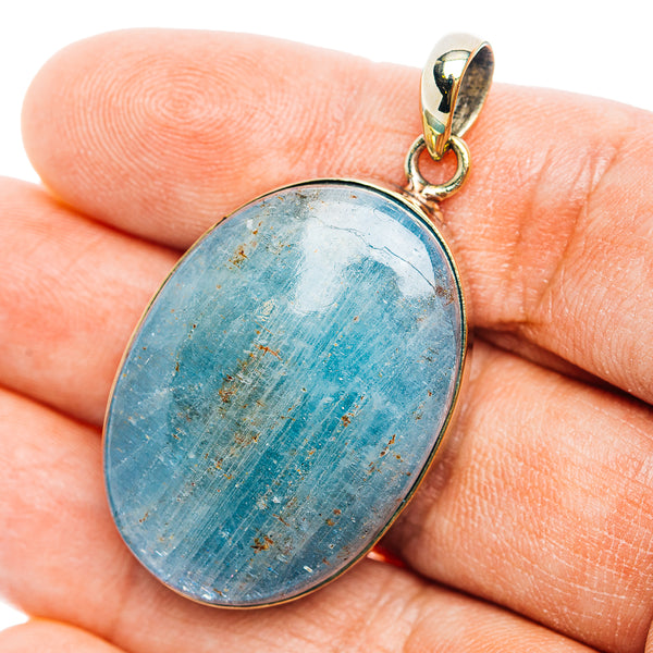 Oval aquamarine pendant with German silver bezel and bail, blue stone in close-up