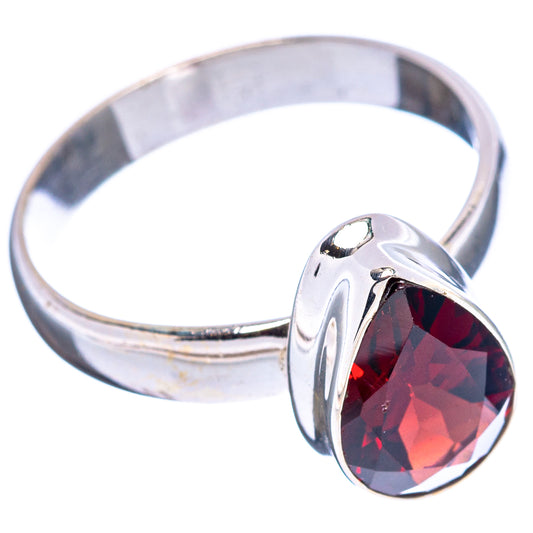 Sterling silver band with faceted dark red garnet oval centerpiece, side view