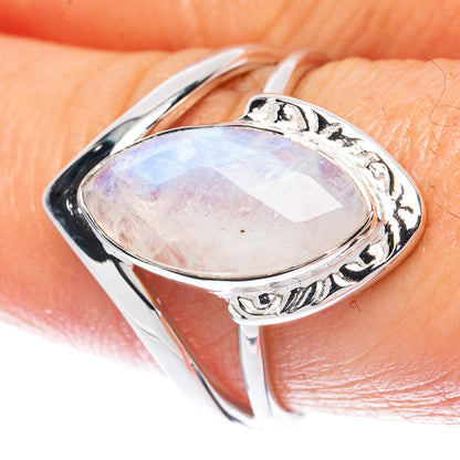 Sterling silver ring with oval rainbow moonstone and ornate metal frame