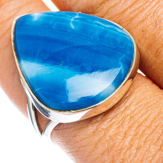 Sterling silver opal ring with blue teardrop cabochon, bezel detail—close-up