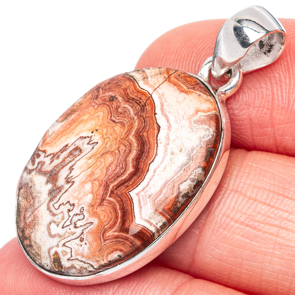 Crazy lace agate pendant in oval sterling silver bezel with bail, red and cream lacy bands