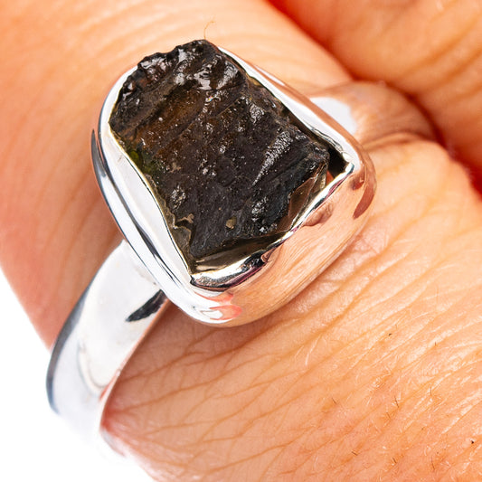 Sterling silver moldavite ring with dark green rough stone, bezel-set on band