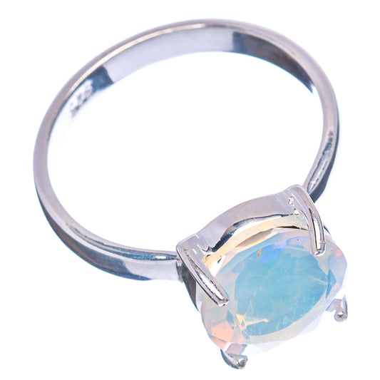 Sterling silver ring featuring an oval light-blue opal-style stone in prong setting