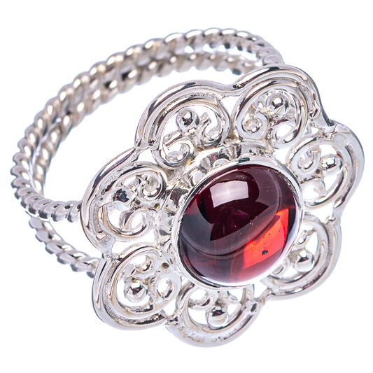 Sterling silver garnet ring with round dark red gemstone in decorative filigree bezel