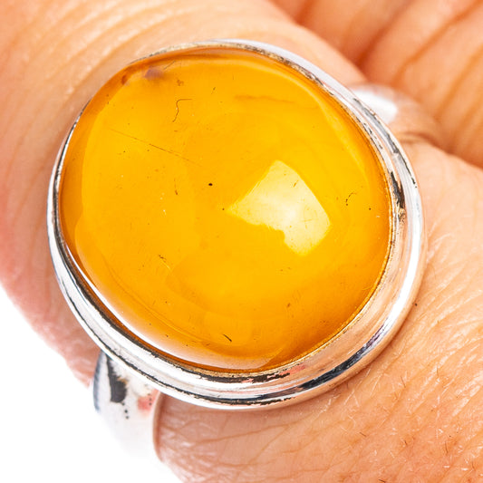 Sterling silver amber ring, size 8, oval yellow-brown gemstone cabochon top view