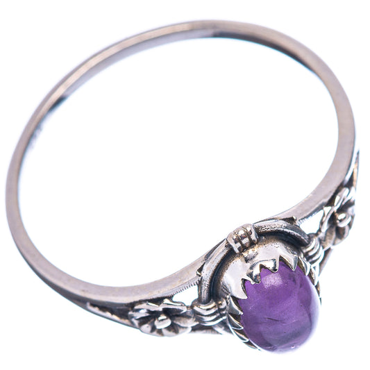 Sterling silver amethyst ring with oval purple cabochon and textured band