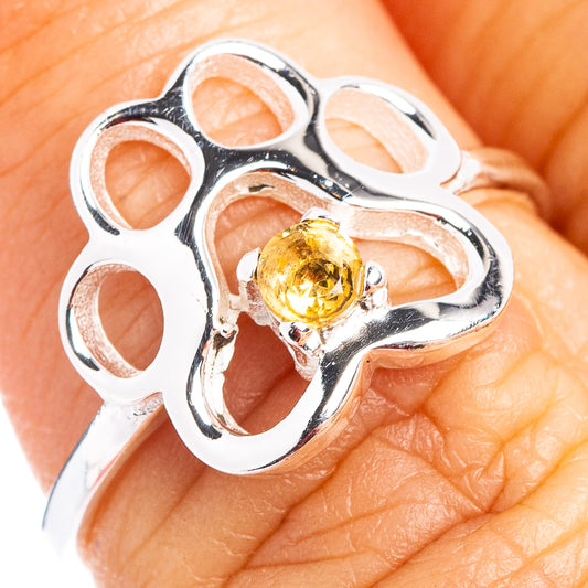 Paw-shaped sterling silver ring with round citrine gemstone center