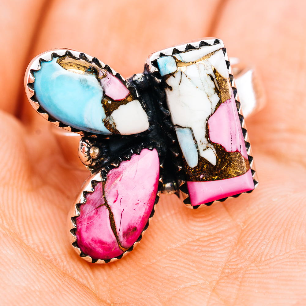 Southwestern-style ring with oval turquoise, pink, and white inlays in a black setting