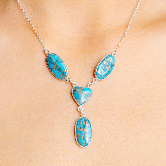 Turquoise heart pendant necklace with oval blue stone charms on silver chain
