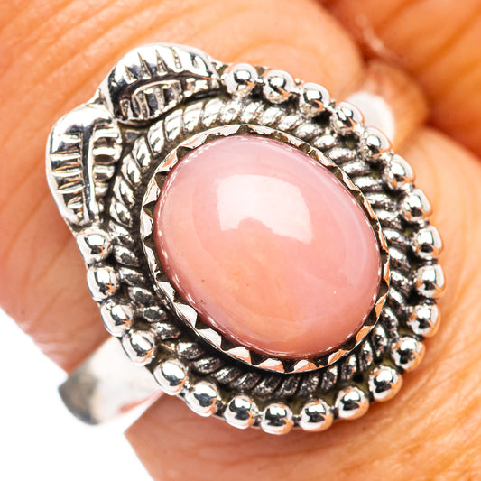 Sterling silver pink opal ring with oval cabochon and beaded engraved halo
