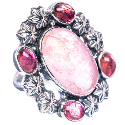 Sterling silver ring with large oval pink center stone and five pink round side gems