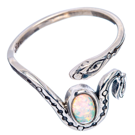 Sterling silver snake ring with oval opal cabochon, ornate openwork and dark engraved accents