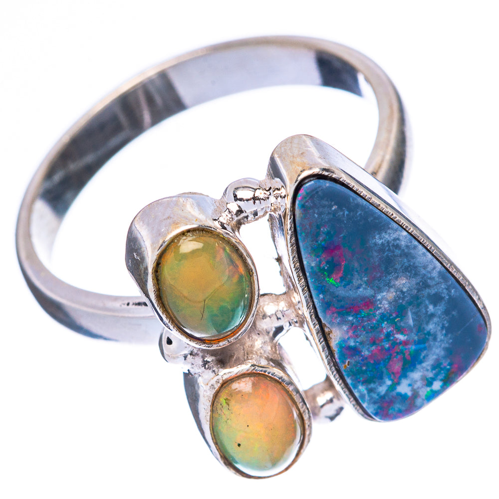 Sterling silver opal ring with blue oval top stone and two green opal accents