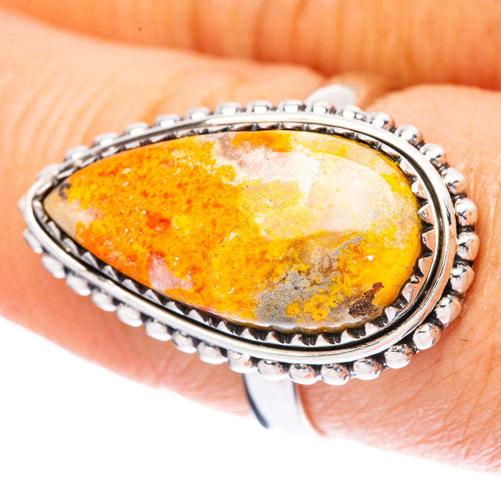Sterling silver bezel ring with orange-yellow teardrop bumblebee jasper cabochon
