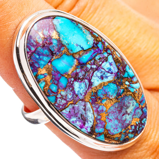 Sterling silver ring with oval purple turquoise cabochon, copper veining.