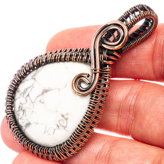 Copper wire-wrapped howlite teardrop pendant detail with oxidized finish and loop bail