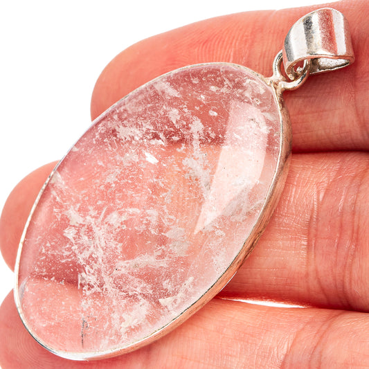 Selenite pendant, oval teardrop with pale pink speckled stone and silver bail