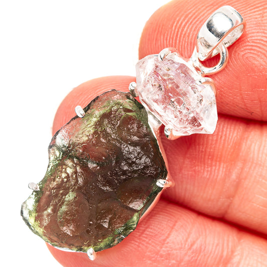 Sterling silver pendant with green rough moldavite and clear crystal, prong-set