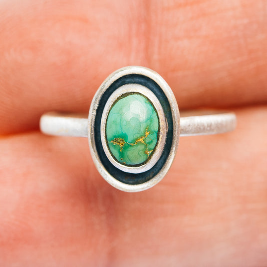 Sterling silver turquoise oval ring on band, double bezel with dark edge detail