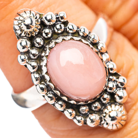 Sterling silver ring with pink oval opal cabochon and beaded halo