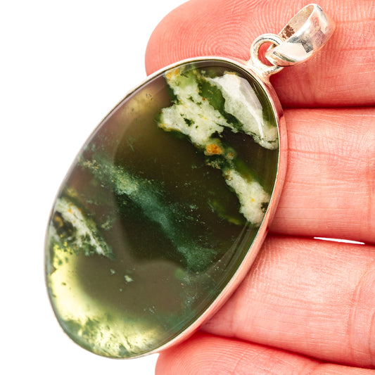 Oval green chrome chalcedony pendant with .925 sterling silver bezel, bail loop.