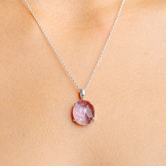 Sterling silver amethyst pendant necklace with round purple gemstone on a thin chain