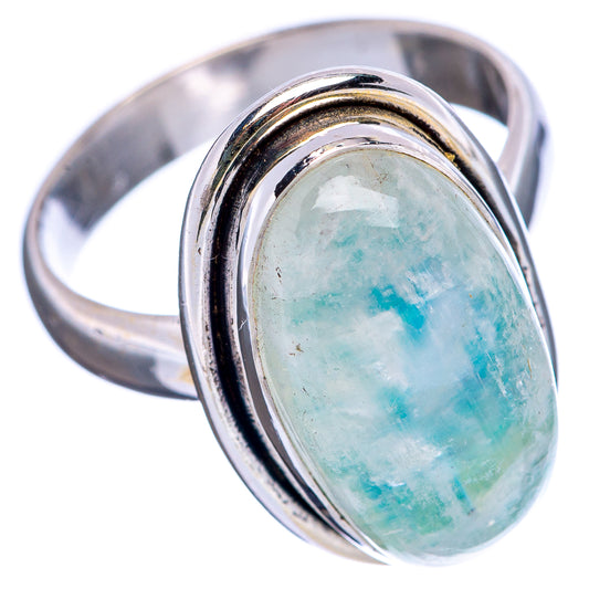 Sterling silver moonstone ring with oval green-blue iridescent cabochon, angled view