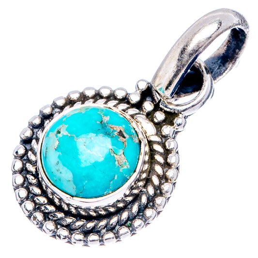 Round turquoise pendant with textured sterling silver border and hanging loop bail