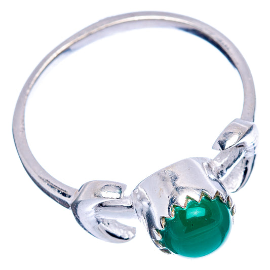 Sterling silver dainty ring with green onyx oval cabochon on side, knot-style setting