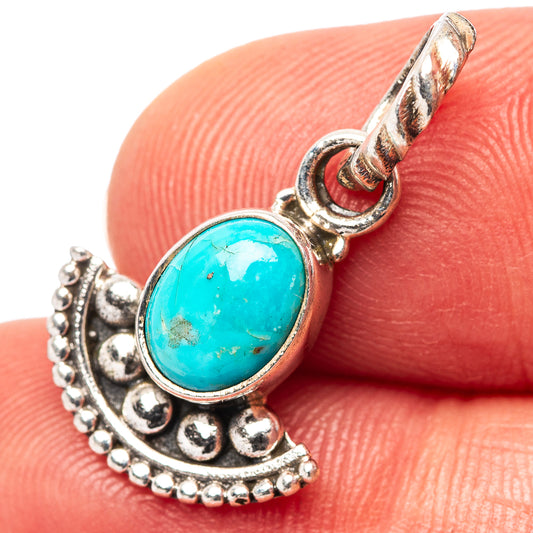 Turquoise oval pendant in .925 sterling silver with textured crescent setting