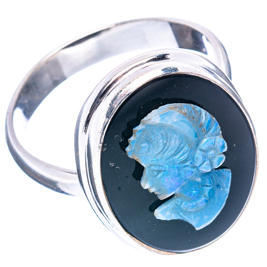 Sterling silver ring showing blue cameo set in black oval bezel, side view