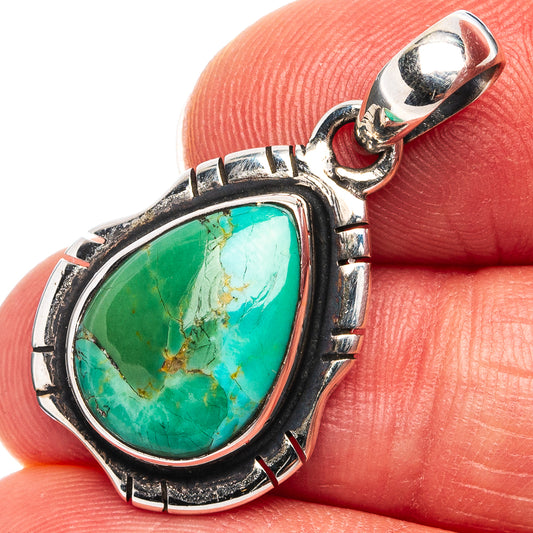 Sterling silver turquoise teardrop pendant with ornate bezel and loop bail
