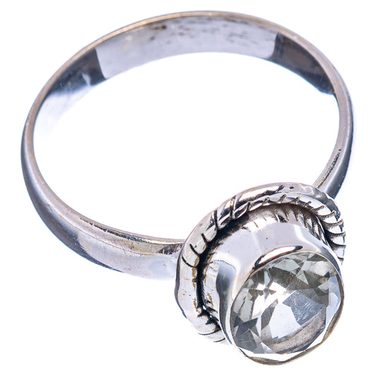 Sterling silver ring with braided metal band and faceted oval gemstone