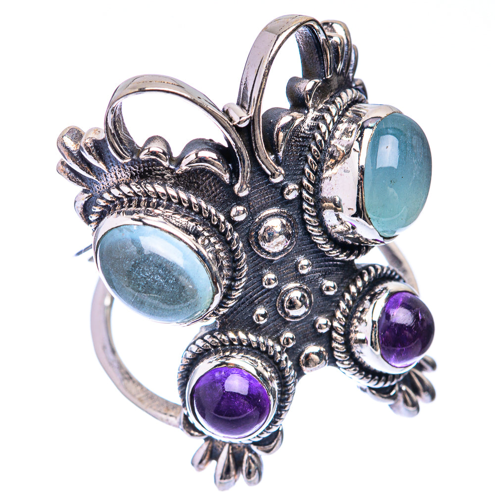 Ornate sterling silver side ring with blue aquamarine and purple amethyst cabochons