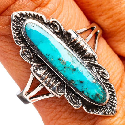 Turquoise oval gemstone sterling silver ring with ornate leafed bezel