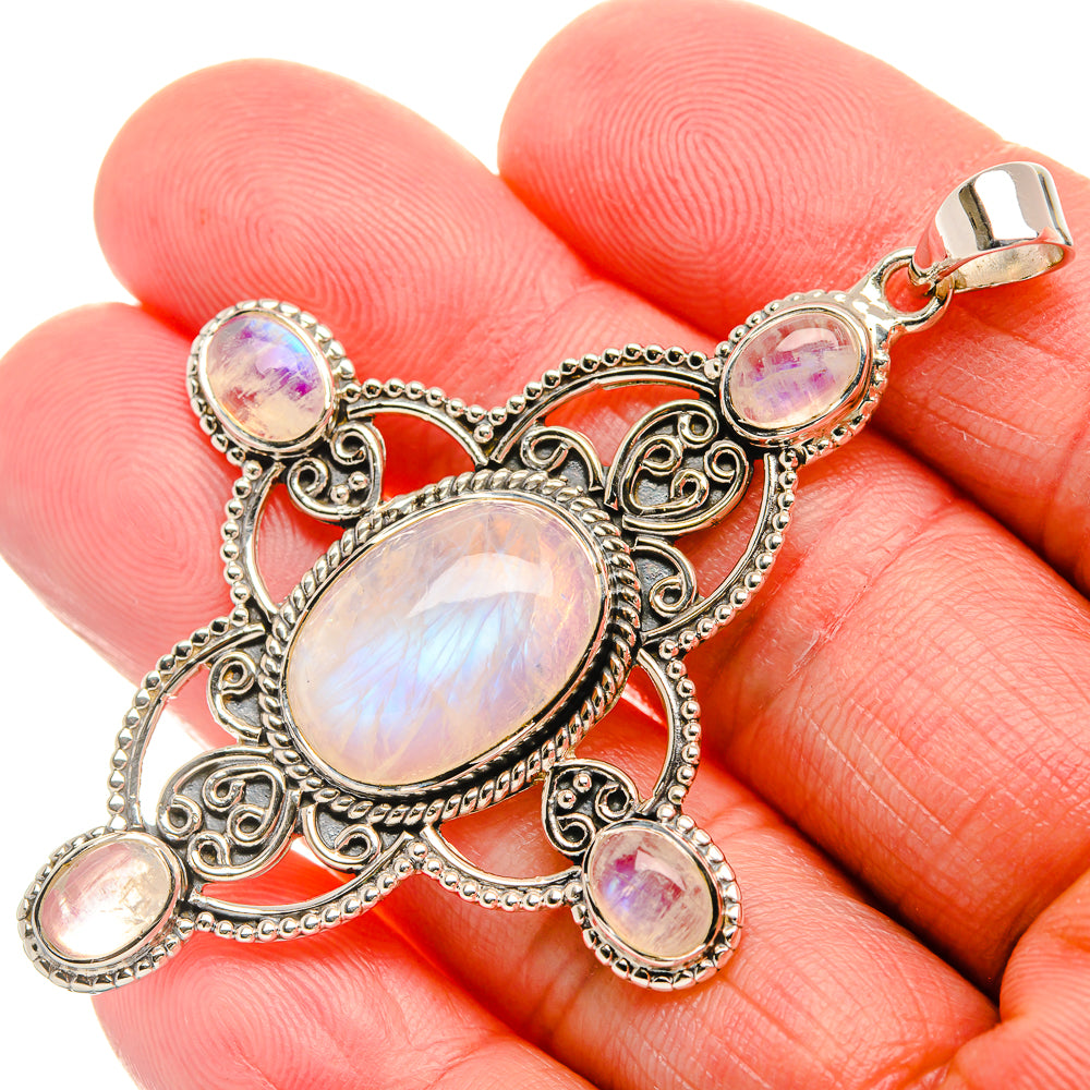 Sterling silver rainbow moonstone pendant with oval opalescent stones and ornate frame