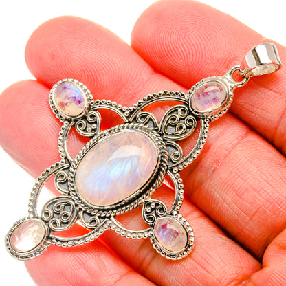 Sterling silver rainbow moonstone pendant with oval opalescent stones and ornate frame